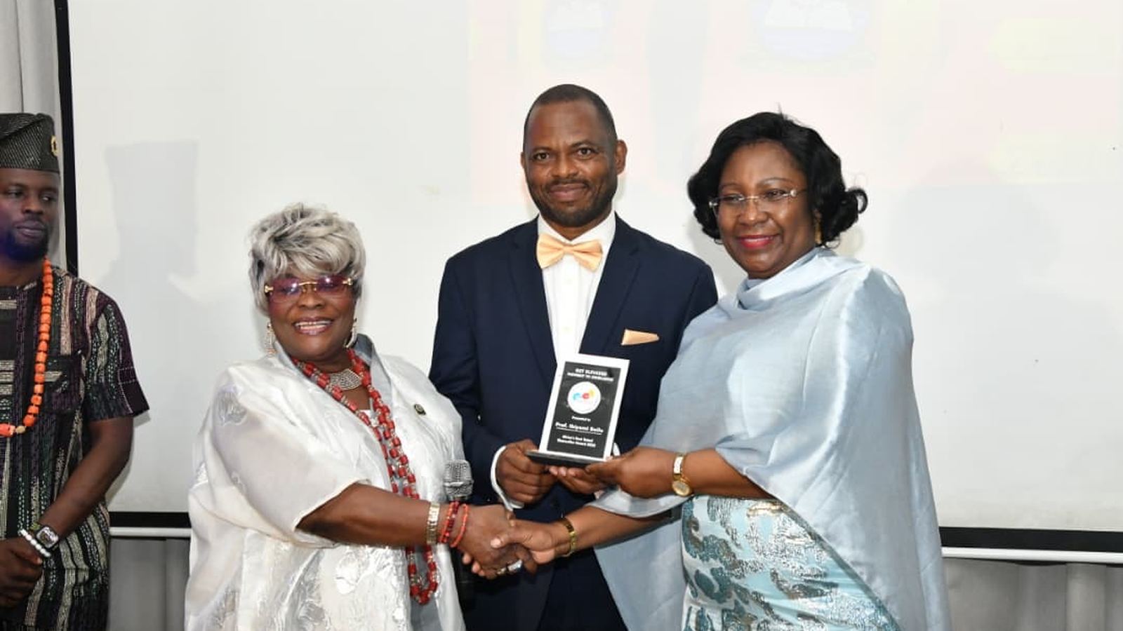 Award presentation to a female honouree at a Get Elevated awards ceremony
